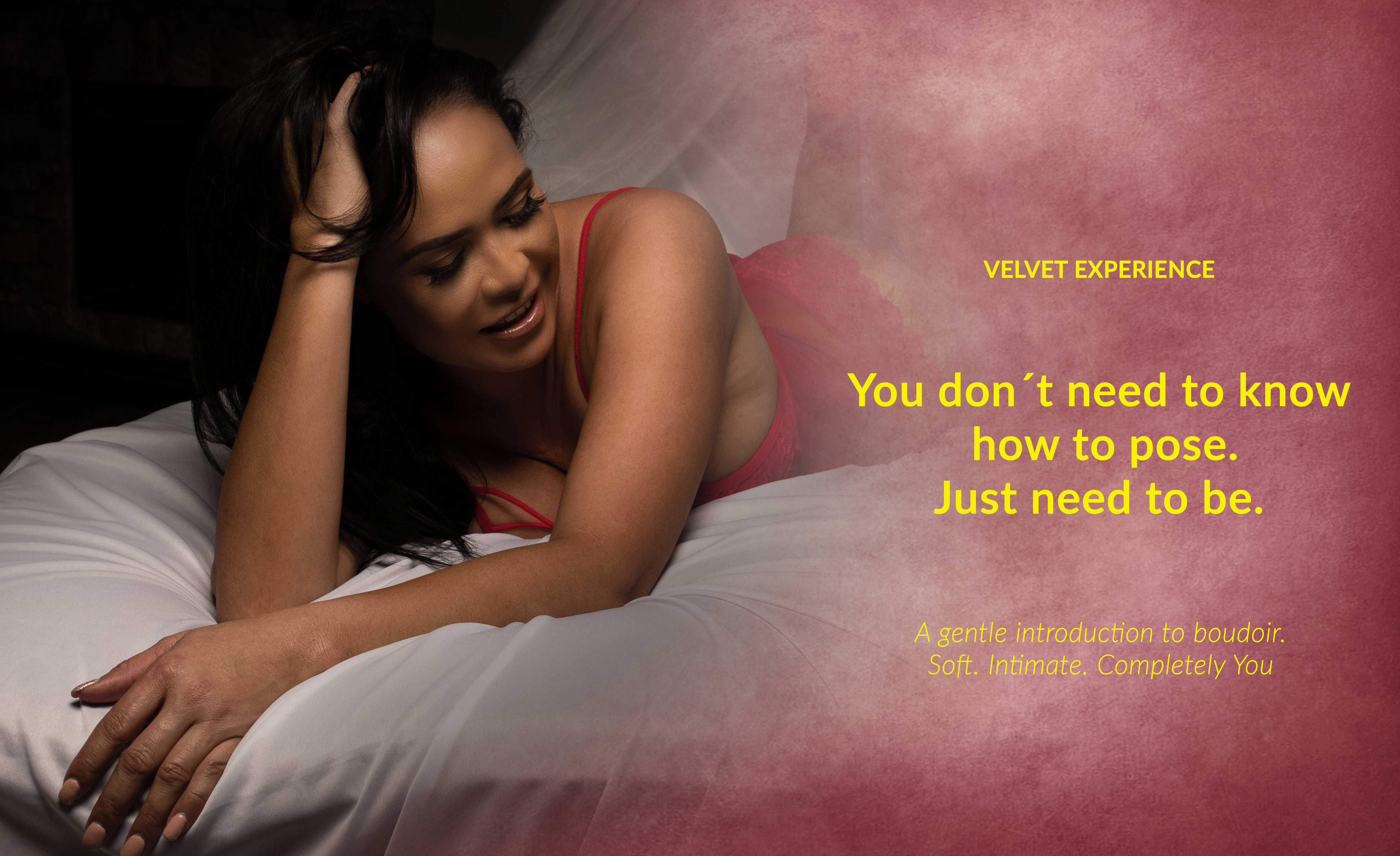 Velvet Boudoir Photography portrait of a woman in soft pink lingerie illuminated by warm cinematic light